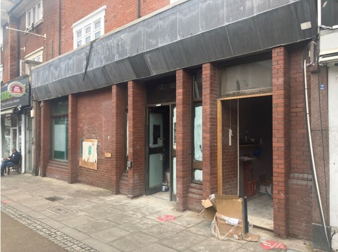 front of former lloyds bank branch in palmers green showing ongoing work to convert the building